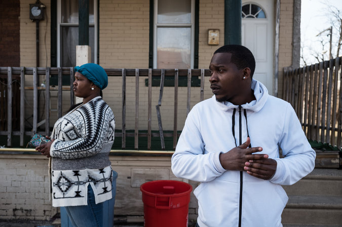 Brittany Gilmore, left, and Charles Chapman in North Camden, near a corner where two of Ms. Gilmore’s relatives were killed in 2011. Credit Todd Heisler/The New York Times