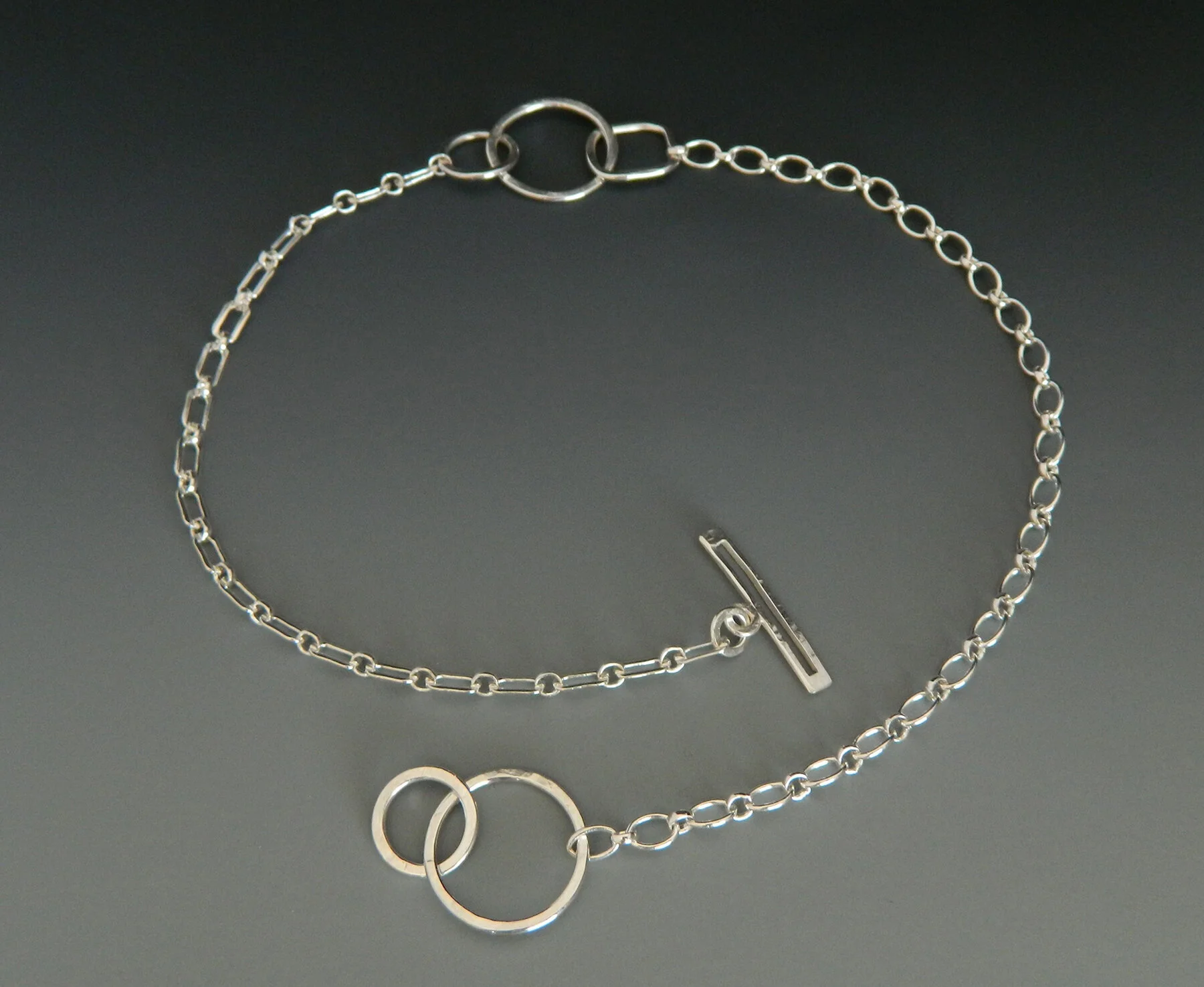 Three Shapes on a Chain with Bar