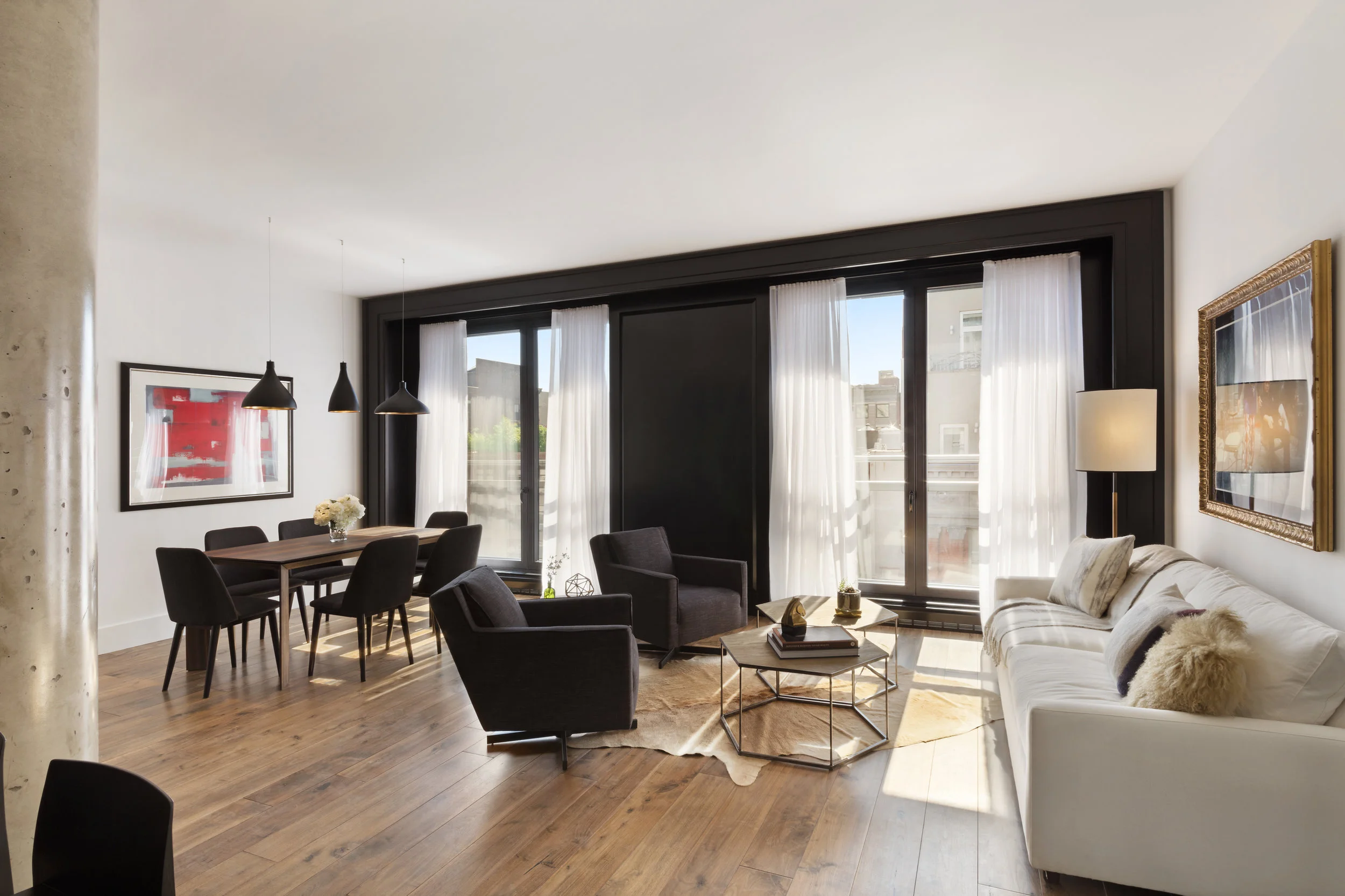 In this Chelsea living/dining room a cowhide rug helps separate and define the two spaces 