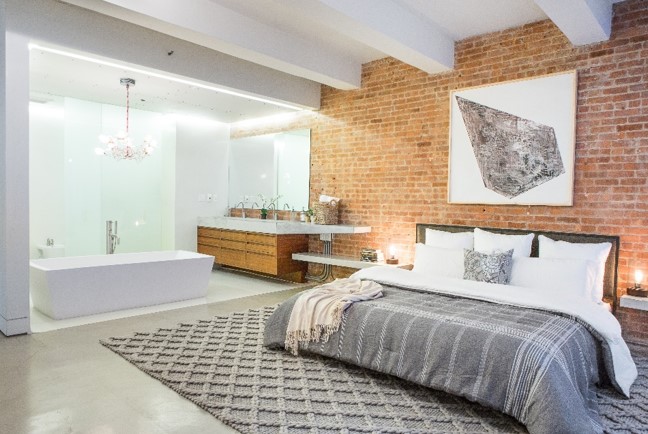 In this Soho loft a chunky rug adds dimension to a monochromatic room