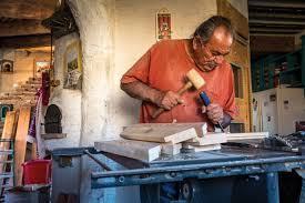 Isabro Ortega working in his home and studio.