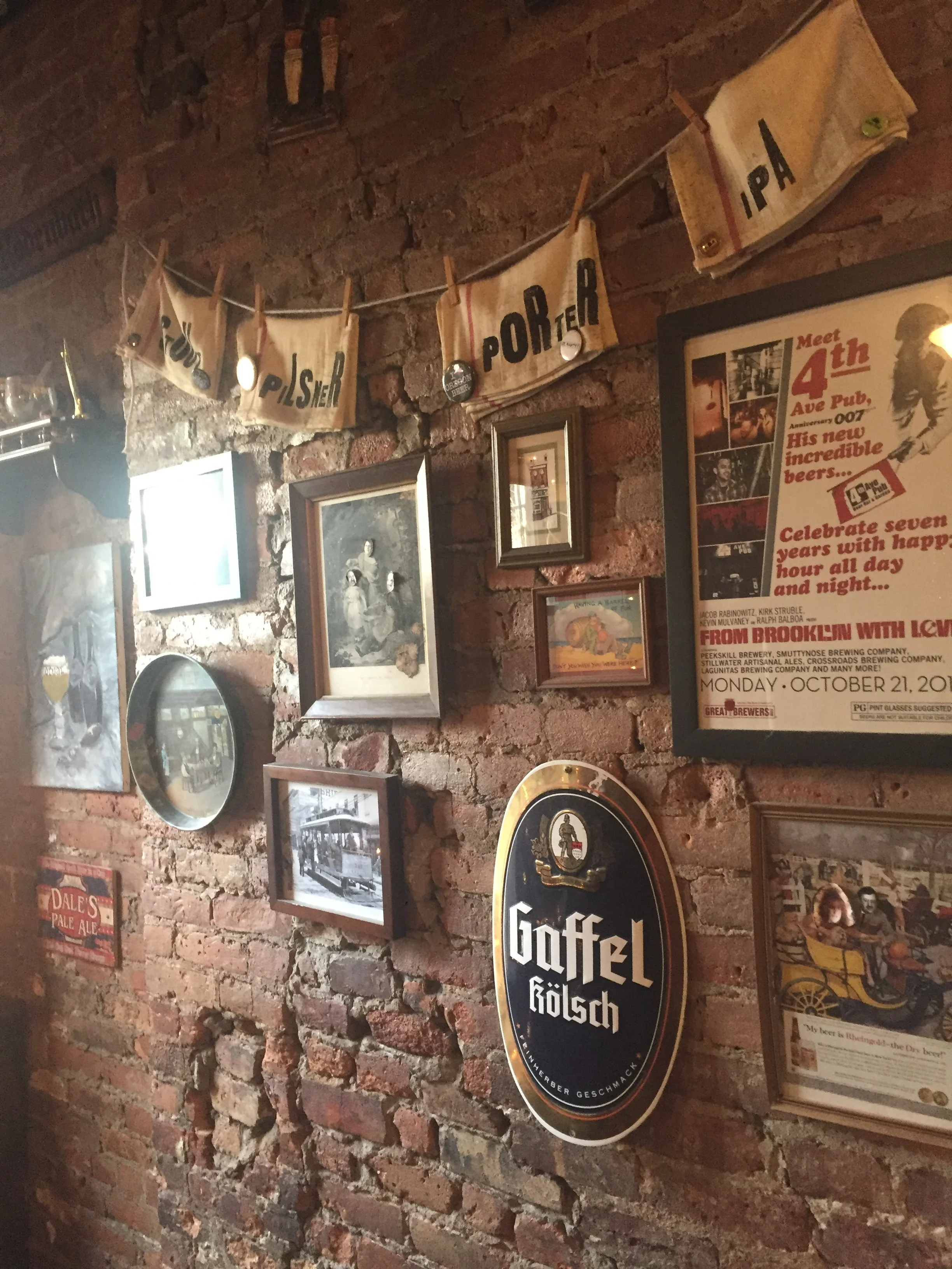 Beer posters hanging on our back wall