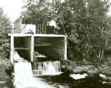 The Mill Race flowing through an early wooden culvert. (Photo courtesy of the Springfield Museum)