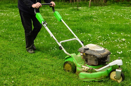30121309_S_mower_man_walking_grass_cutting.jpg