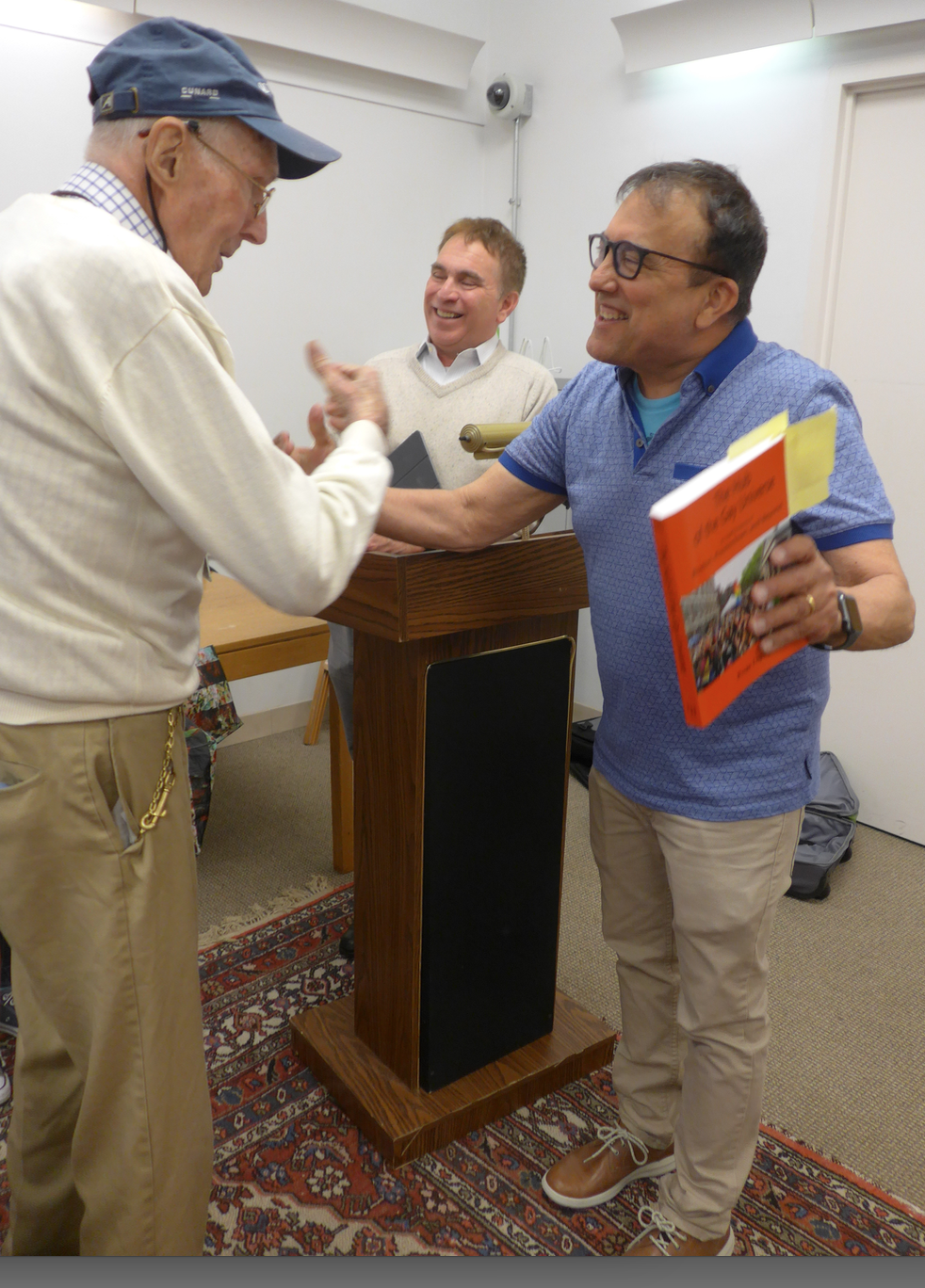Urban historian, Russ Lopez, greets new South End resident John Thomson