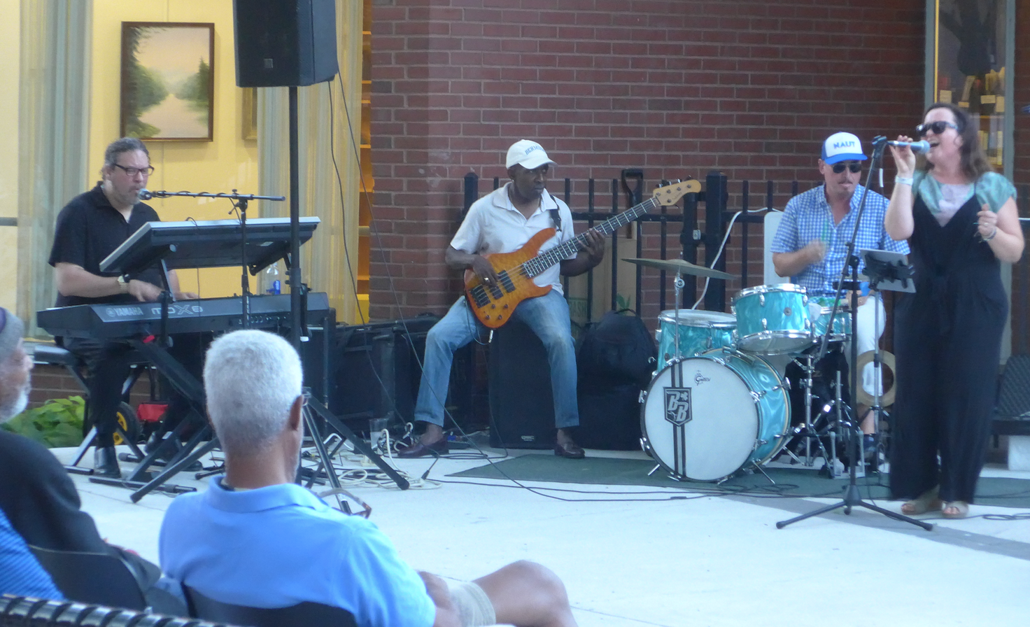 Ben Hillman on keyboard, Charlie Hunt, guitar and Benny Benson on drums accompanying singer Sarah Seminski