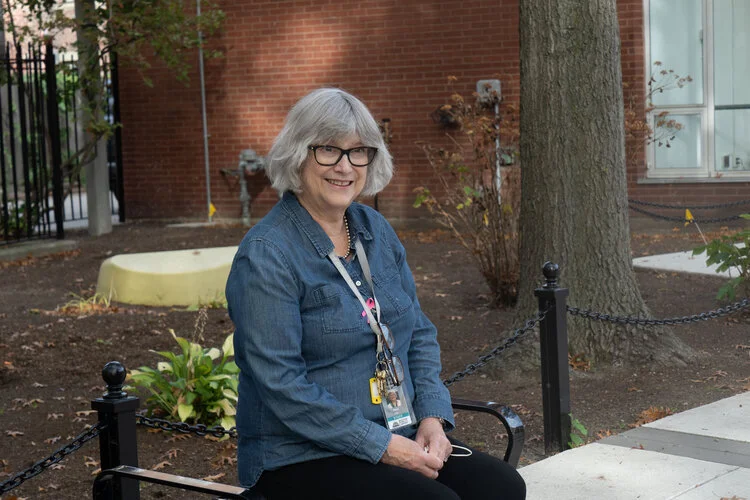 Anne Smart in front of the South End Library