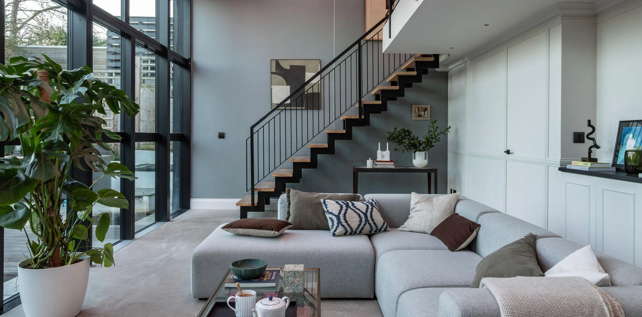Modern living room with smart lighting and environment control installed by The SmartHome Co. in Metro Atlanta
