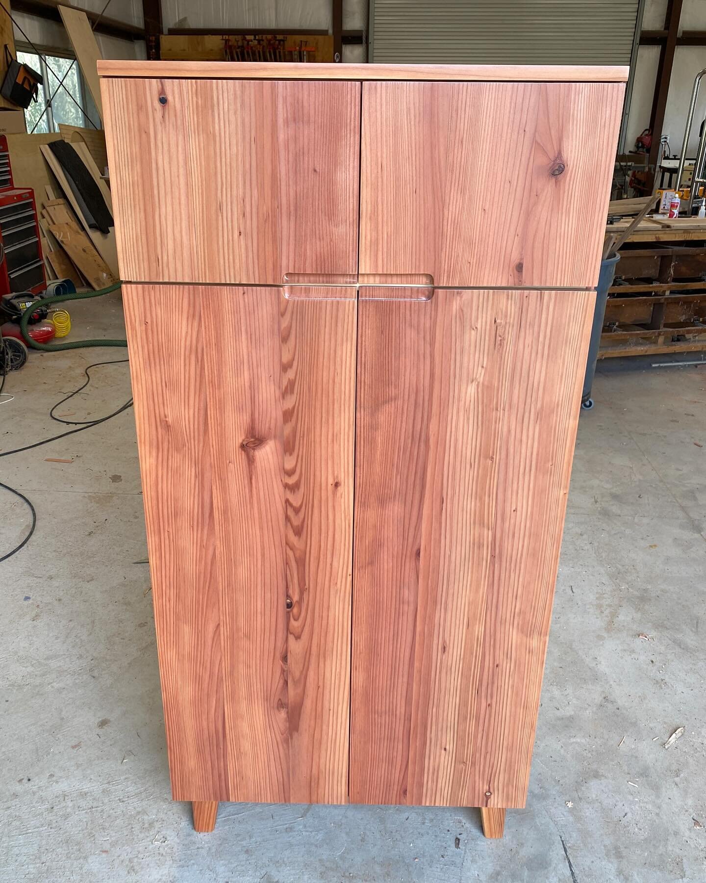 It feels good to end the week with the delivery of a completed project. This solid redwood cabinet was a collaboration with the commissioning client made specifically for a particular spot in his living room. The cabinet features soft close hinges, a