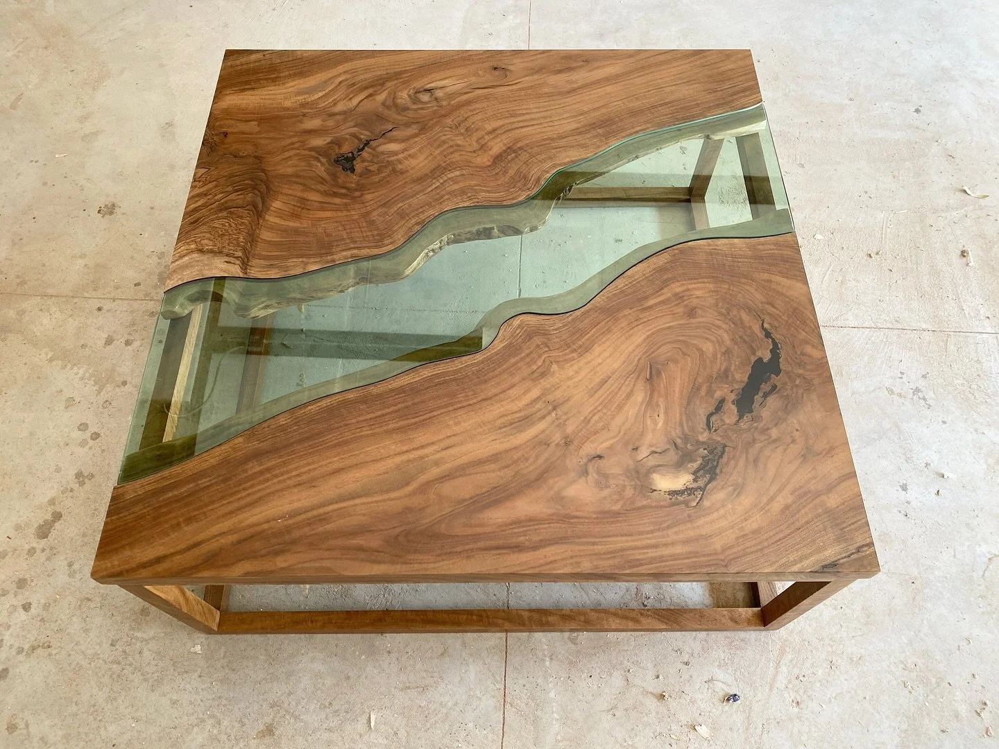 The summer&rsquo;s most challenging piece was the claro walnut coffee table with tempered glass inlay, my first time working with glass. The &ldquo;river&rdquo; shape was designed in CAD program before being cut with a CNC water jet. A green tint was