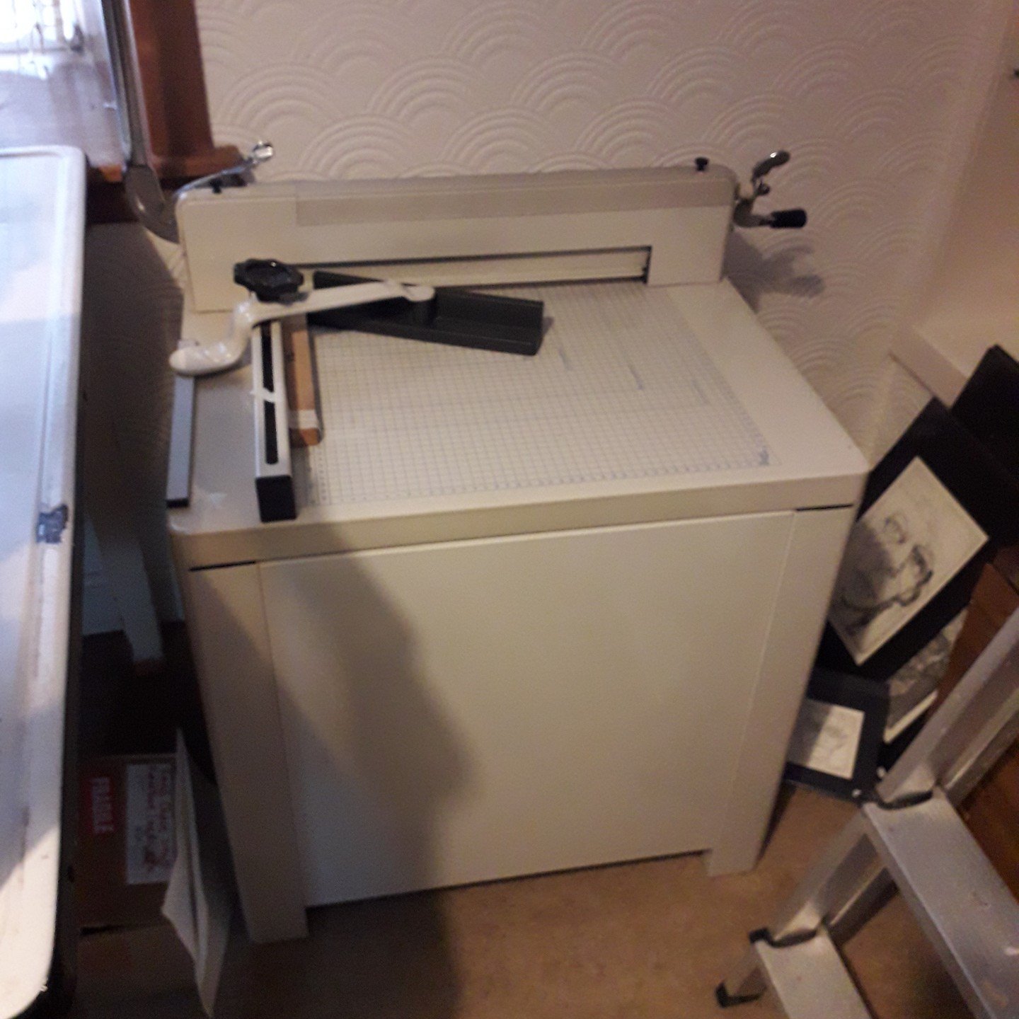 For sale! Guillotine on a metal cupboard with a small drawer at the bottom, clean and tidy, working well. The blade is about 17&quot; long, sharp, no notches and has a safety guard on it. Can cut A3 board, several sheets at a time. The clamp holds th