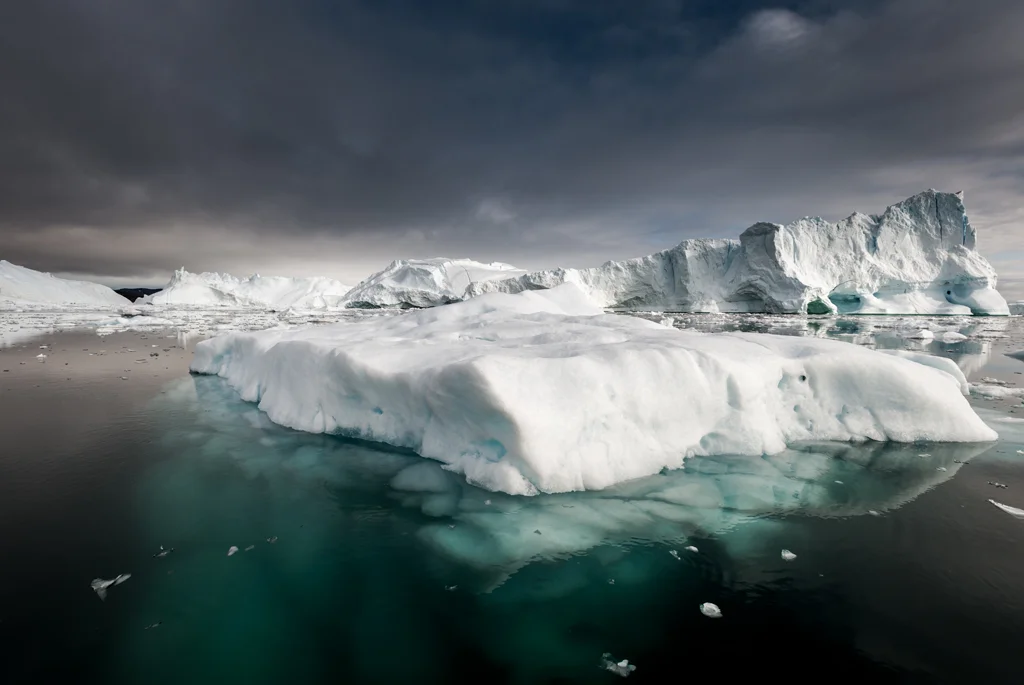 Icebergs in dark sea off the coast of Greenland
