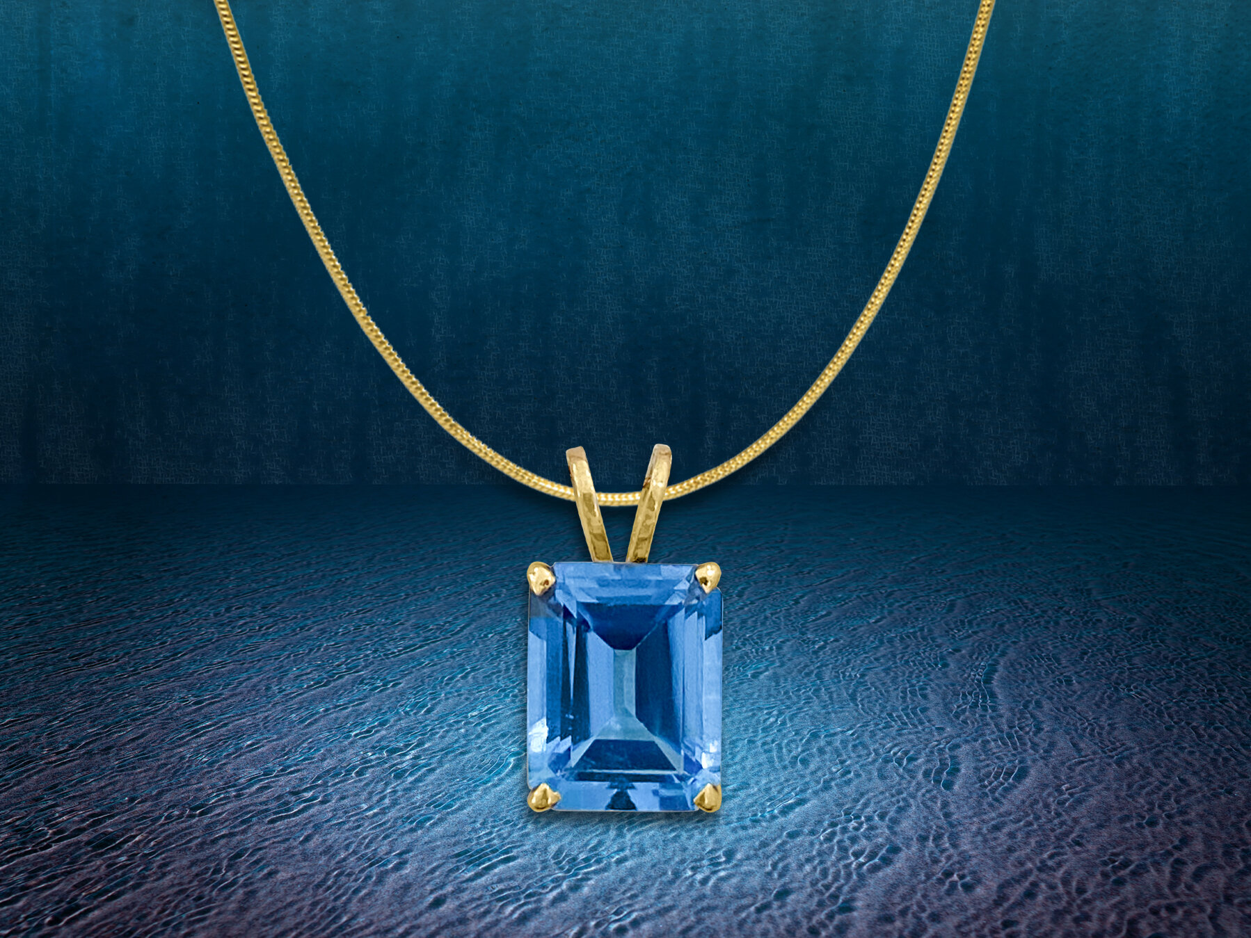 blue topaz tiny pendant w bg.jpg