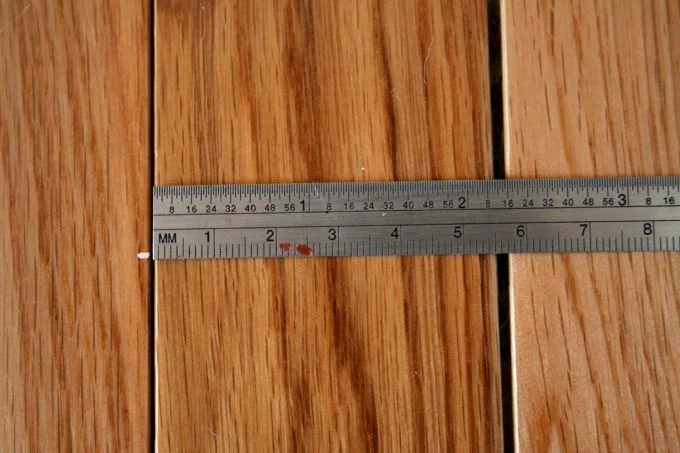 This is an example of a solid hardwood floor that has dried out and is experiencing gaping.