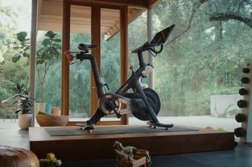 my home gym does not look like this, heauxs. my shit is shoved back on an old sun porch. but I like that they've got some kid's toys around so you really understand THE CONVENIENCE.