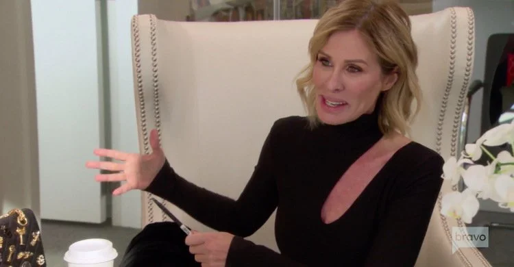 Carole-Radziwill-Black-Cut-Out-Blouse-RHONY.jpg