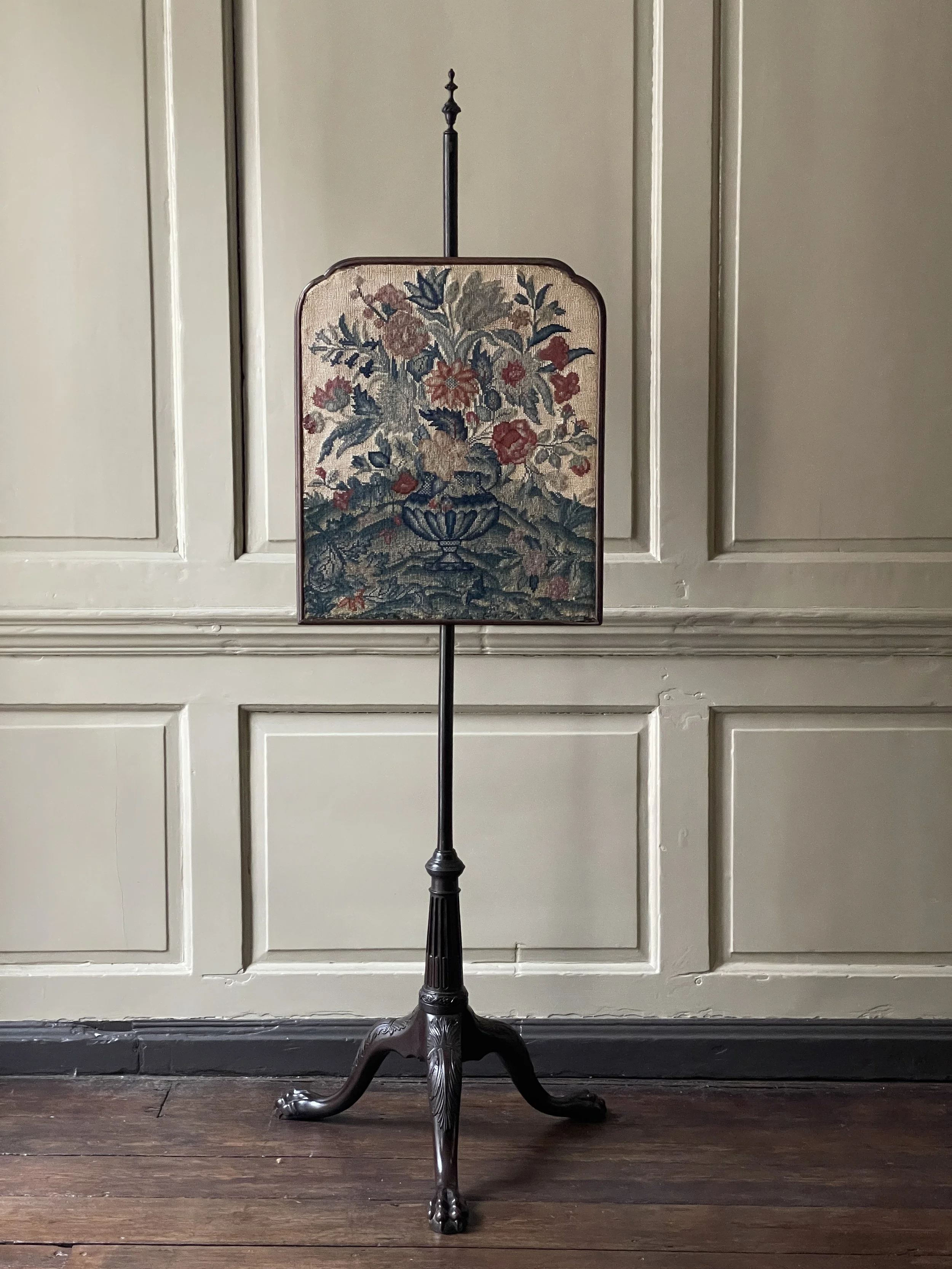 A Georgian II period mahogany pole screen.