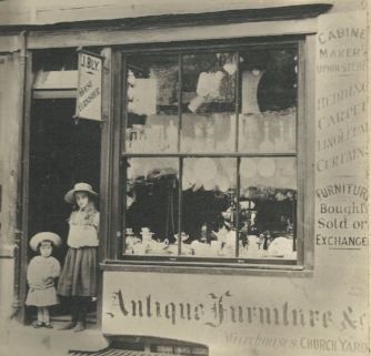 Frank John Bly and sister Doris Bly at John Bly's Shop 22 High Street, Tring. c 1908 