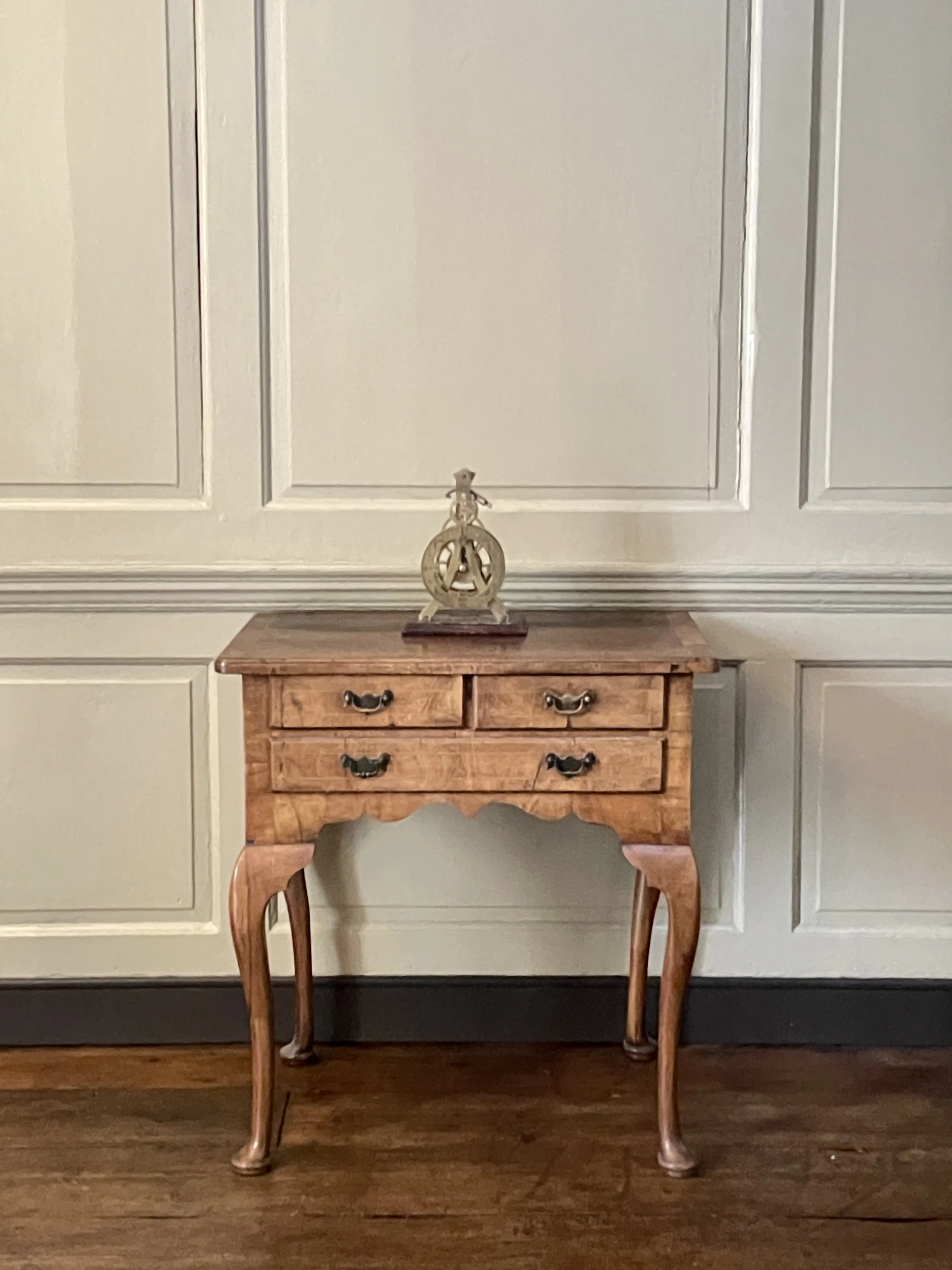 A George II period walnut lowboy.