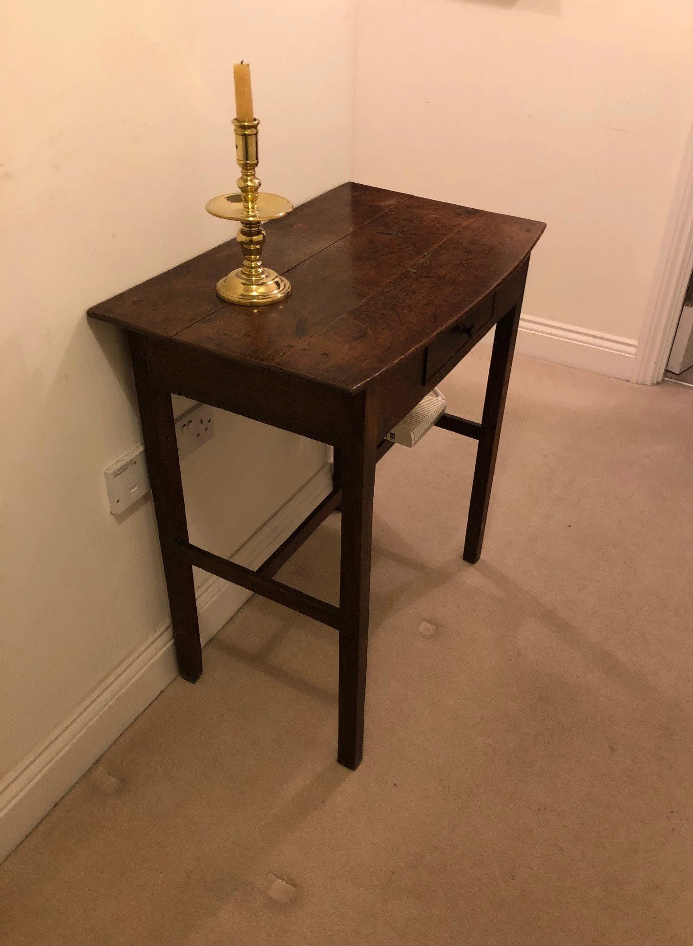 A George III period bow-fronted oak side table.