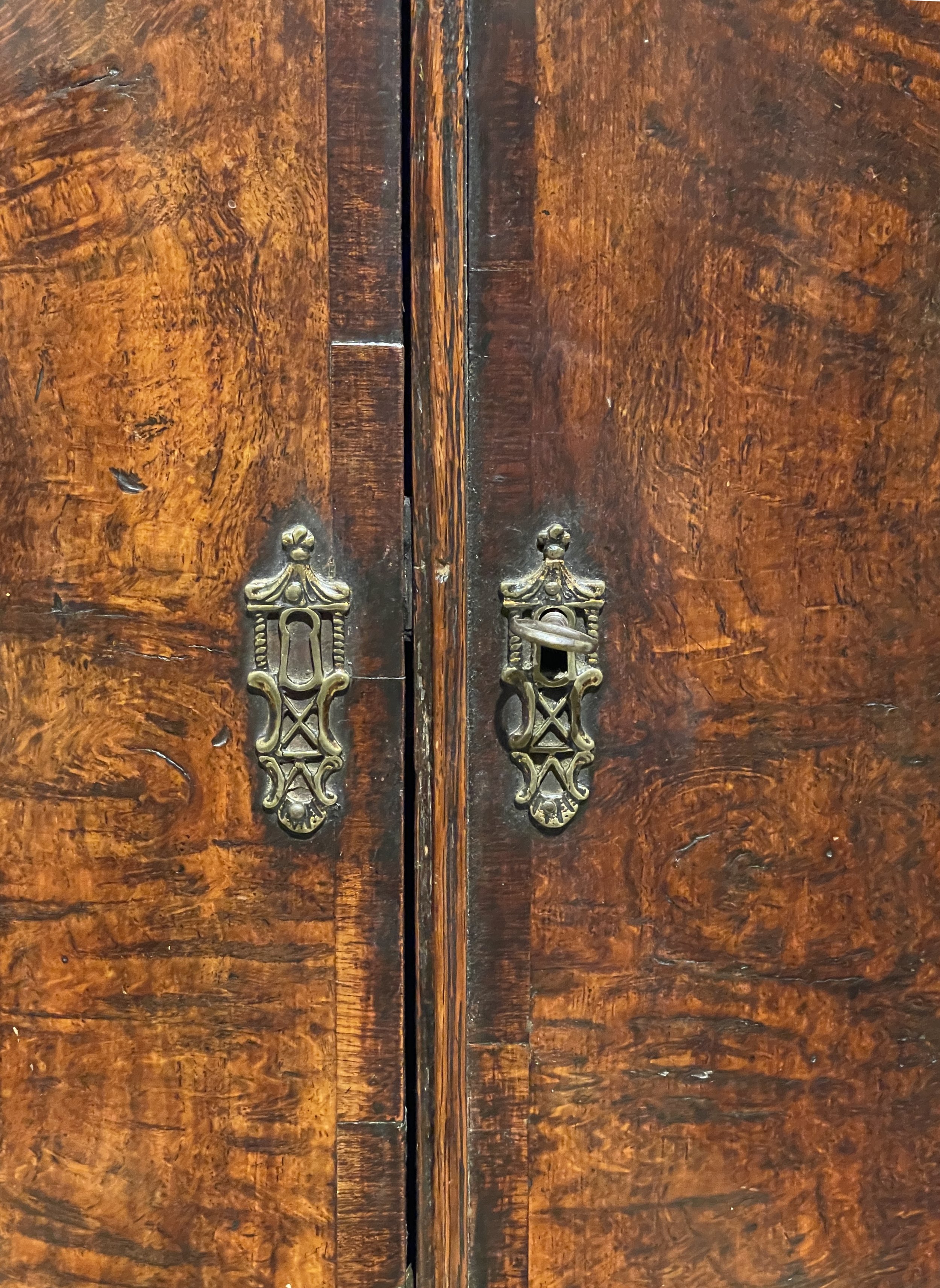 A George III period bow front pollard oak hanging corner cupboard.