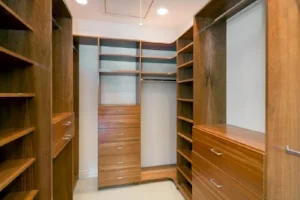 Walk-in-closet-lined-with-cherry-wood-built-ins.-Big-empty-walk-in-wardrobe-in-luxurious-house-min-e1440667597165.jpg