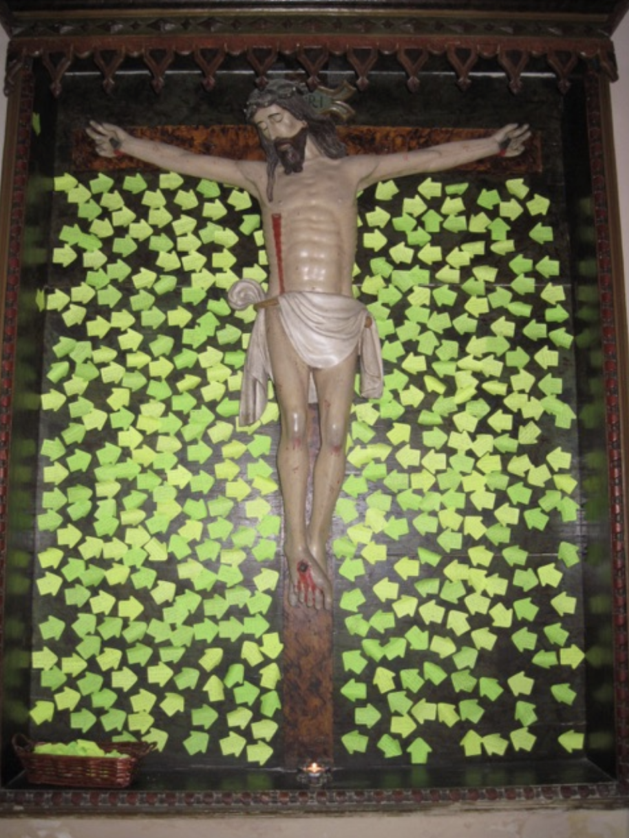 Pilgrims' intentions placed before the Crucifix, many heart breaking