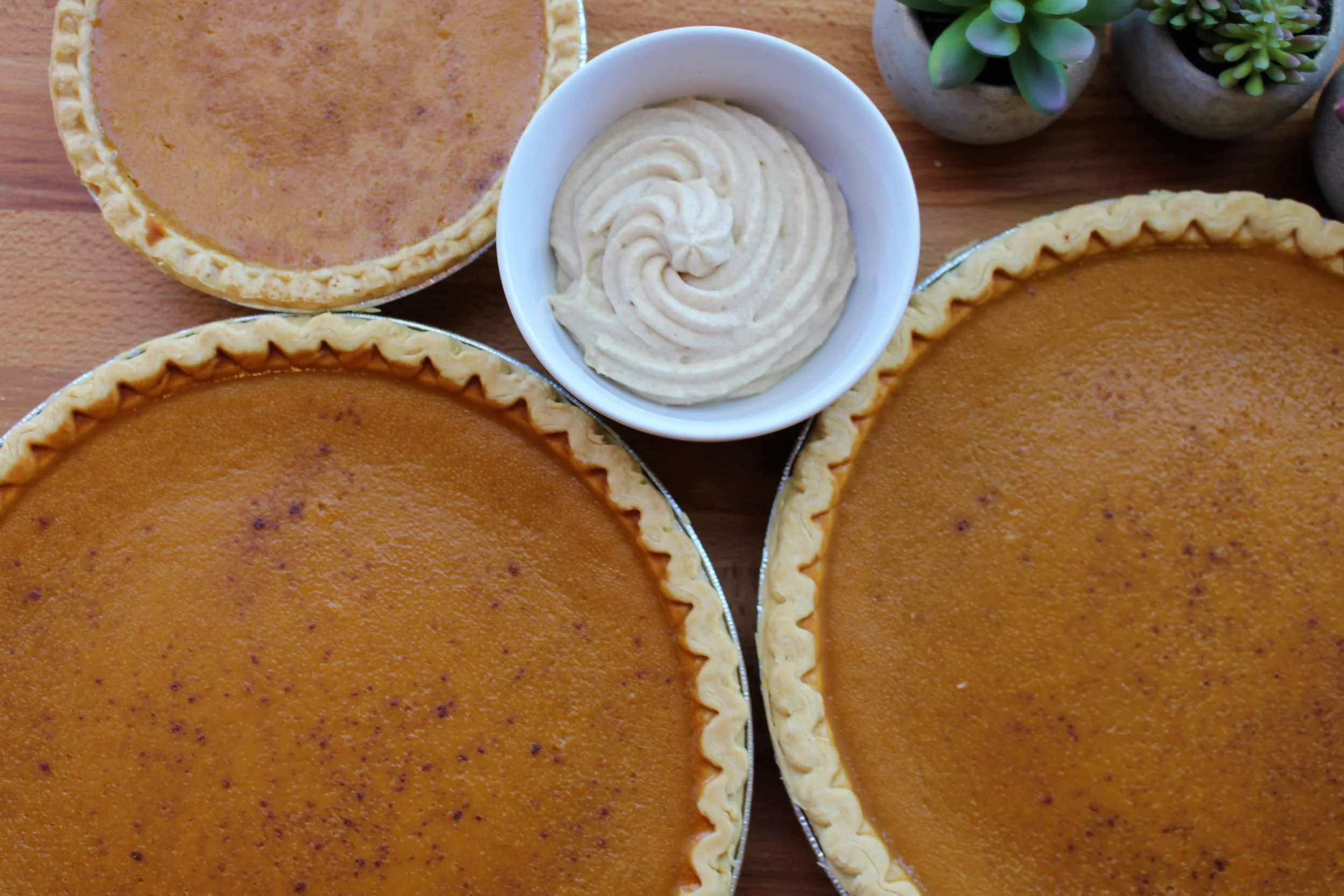 Thanksgiving pumpkin pie with brown sugar and cinnamon whipped cream