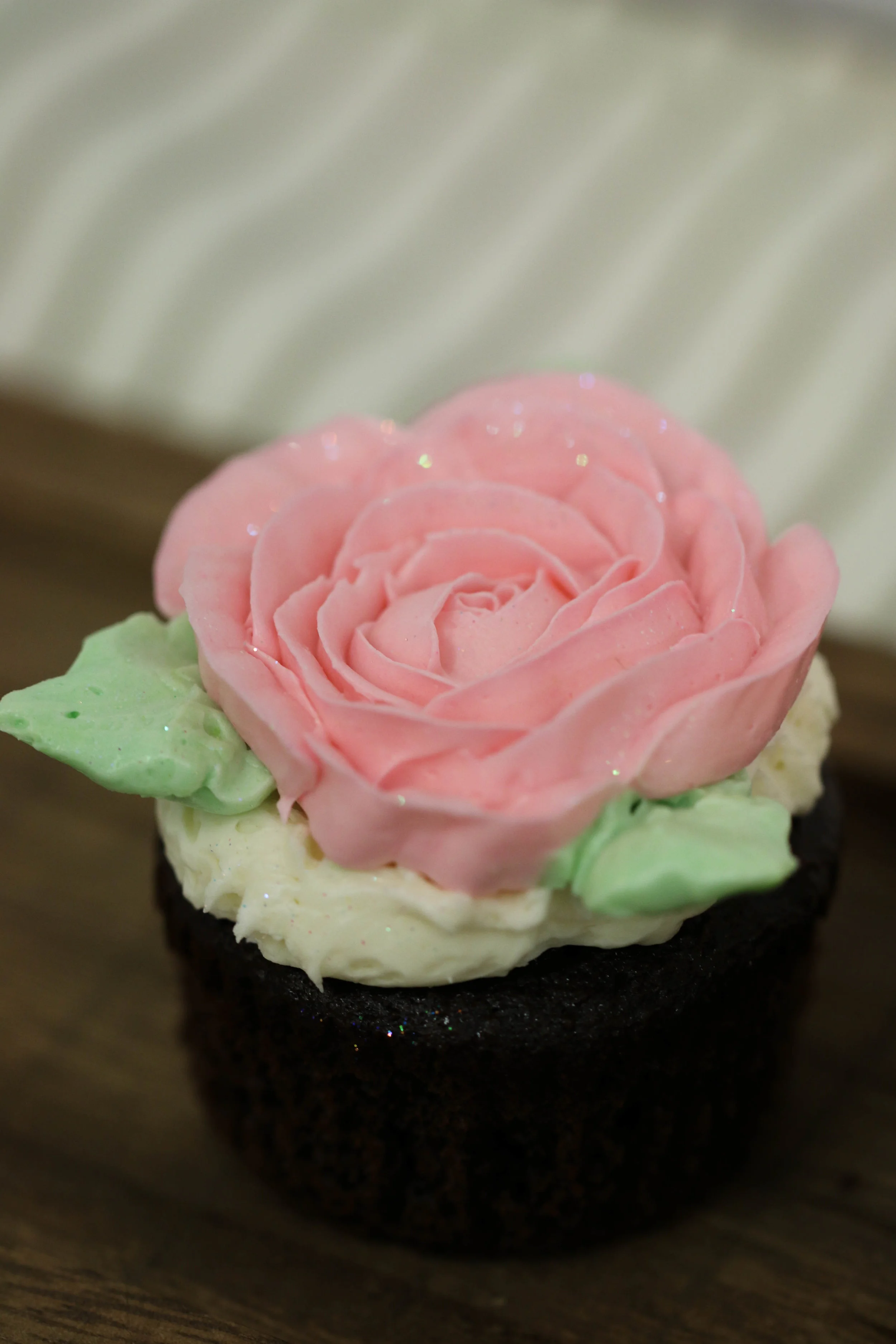 Decorated white cupcake with buttercream frosting