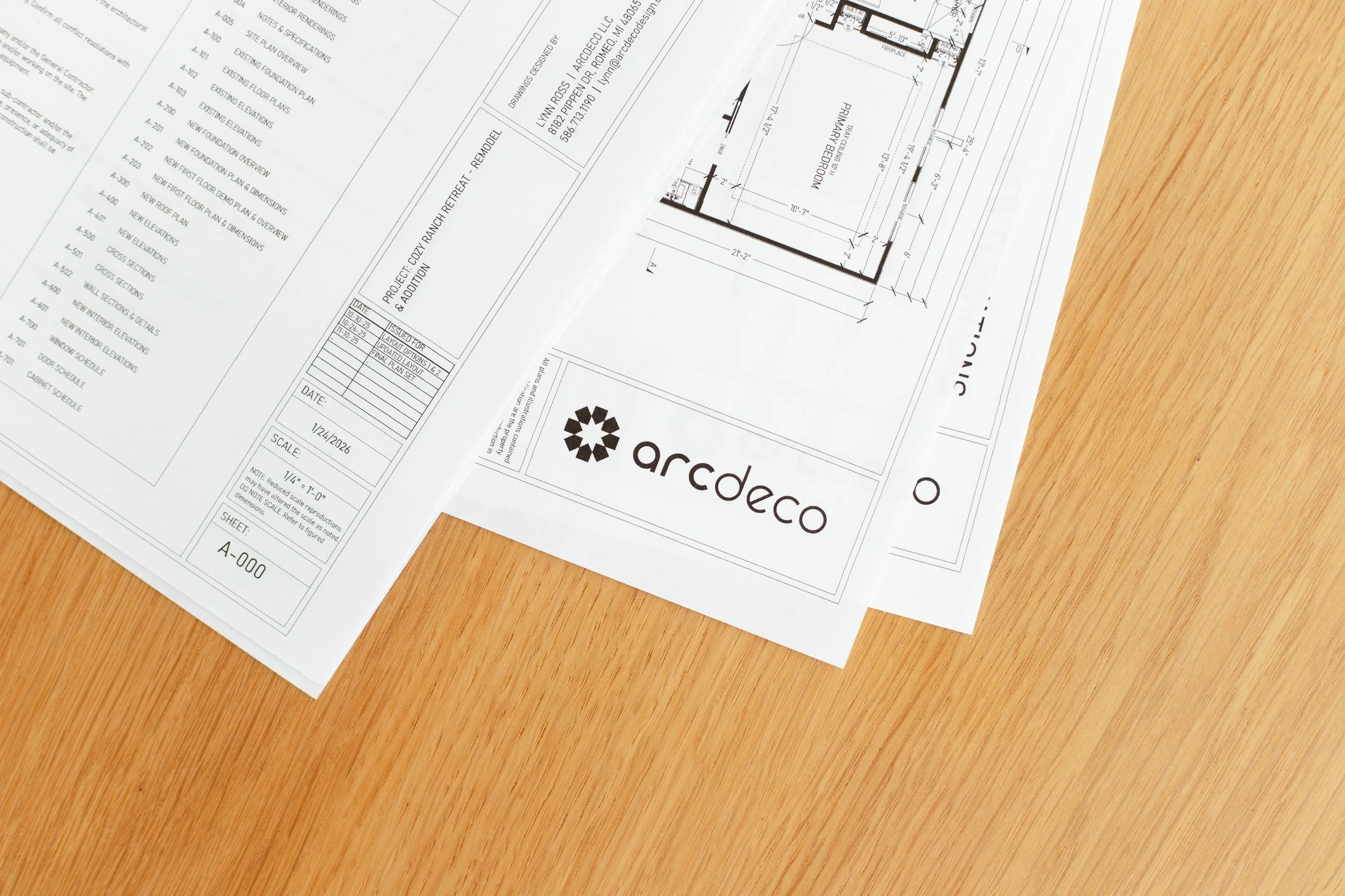 Architectural blueprint drawing of a building, showing room layout and dimensions, with the 'arcdeco' logo at the bottom.