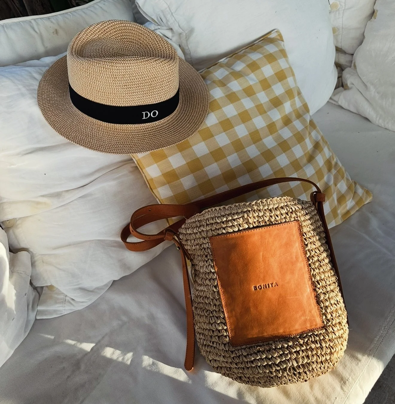 Meet Bonita&rsquo;s Limited Edition raffia tote bucket bag! Perfectly sized to hold all of your essentials, this piece is trimmed with tan leather patch on the front and embossed with &lsquo;BONITA&rsquo; - a nod to this season&rsquo;s logo obsession