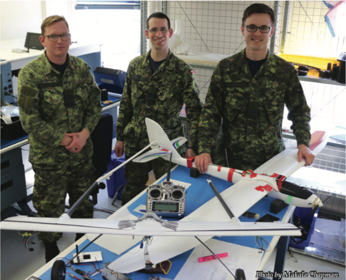 Master Corporal Greg Linton, Captain Dave Hardy and Corporal Stephen Hankinson with the Albatross UAV (foreground).