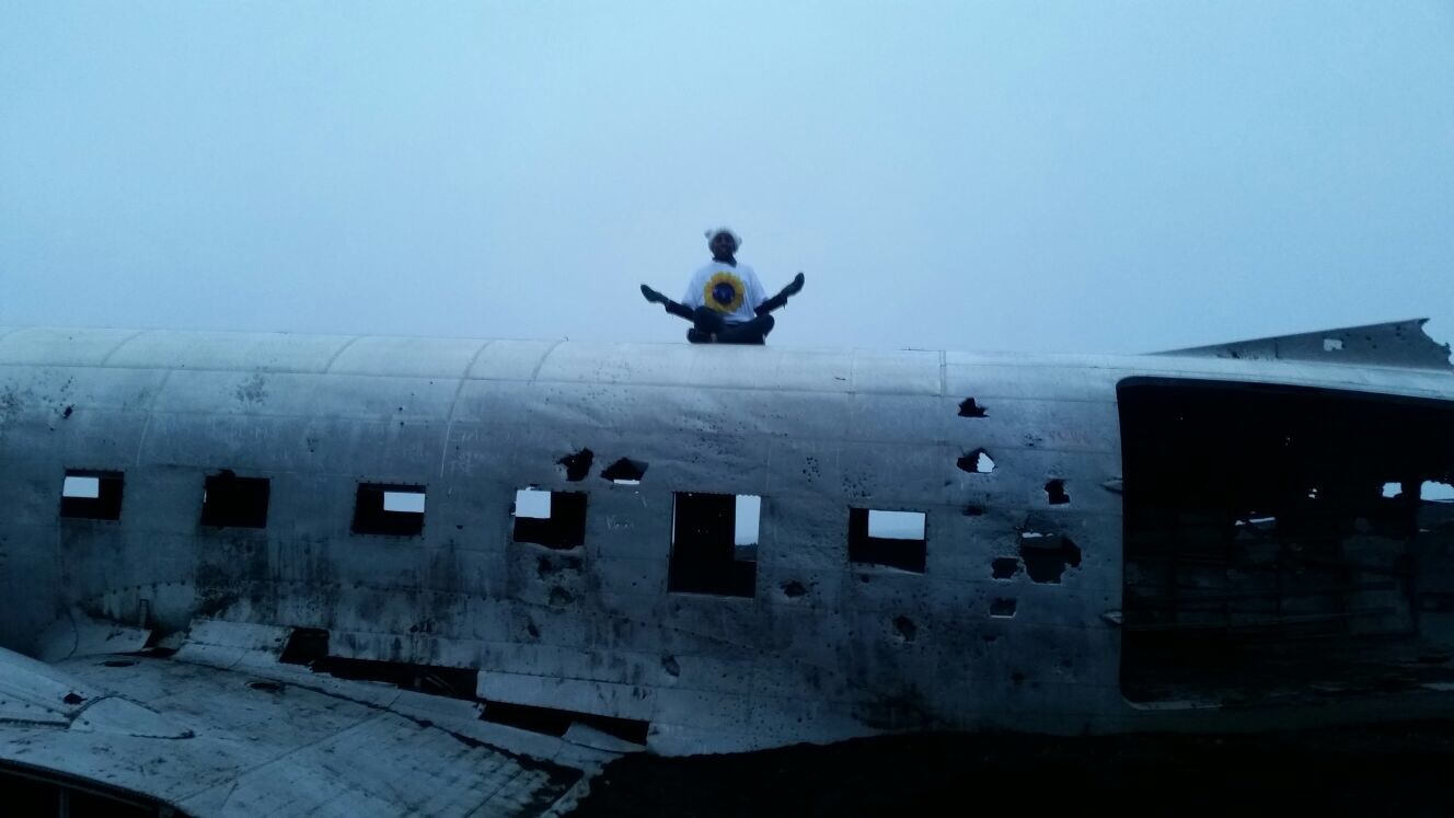 Meditating on an abandoned plane in Solheimasandur, Iceland.