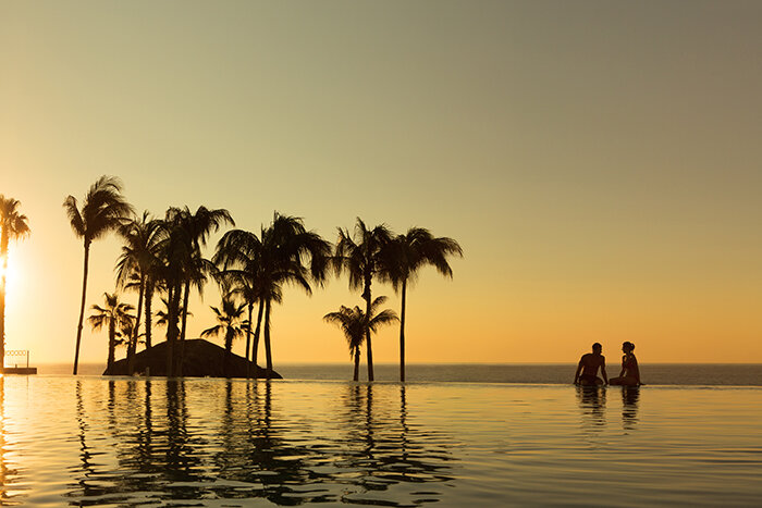 DRELC_EXT_Couple_InfinityPool_Sunset_1A.jpg