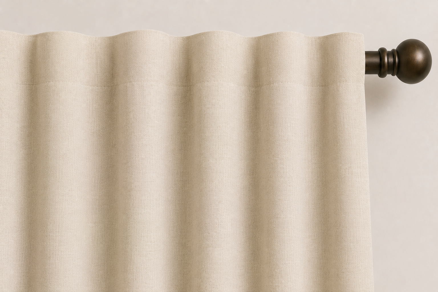 Close-up AI rendering of a cream back tab drapery header on a dark bronze decorative rod, showing soft, evenly spaced folds across the top of the panel with the hanging tabs concealed behind the fabric.