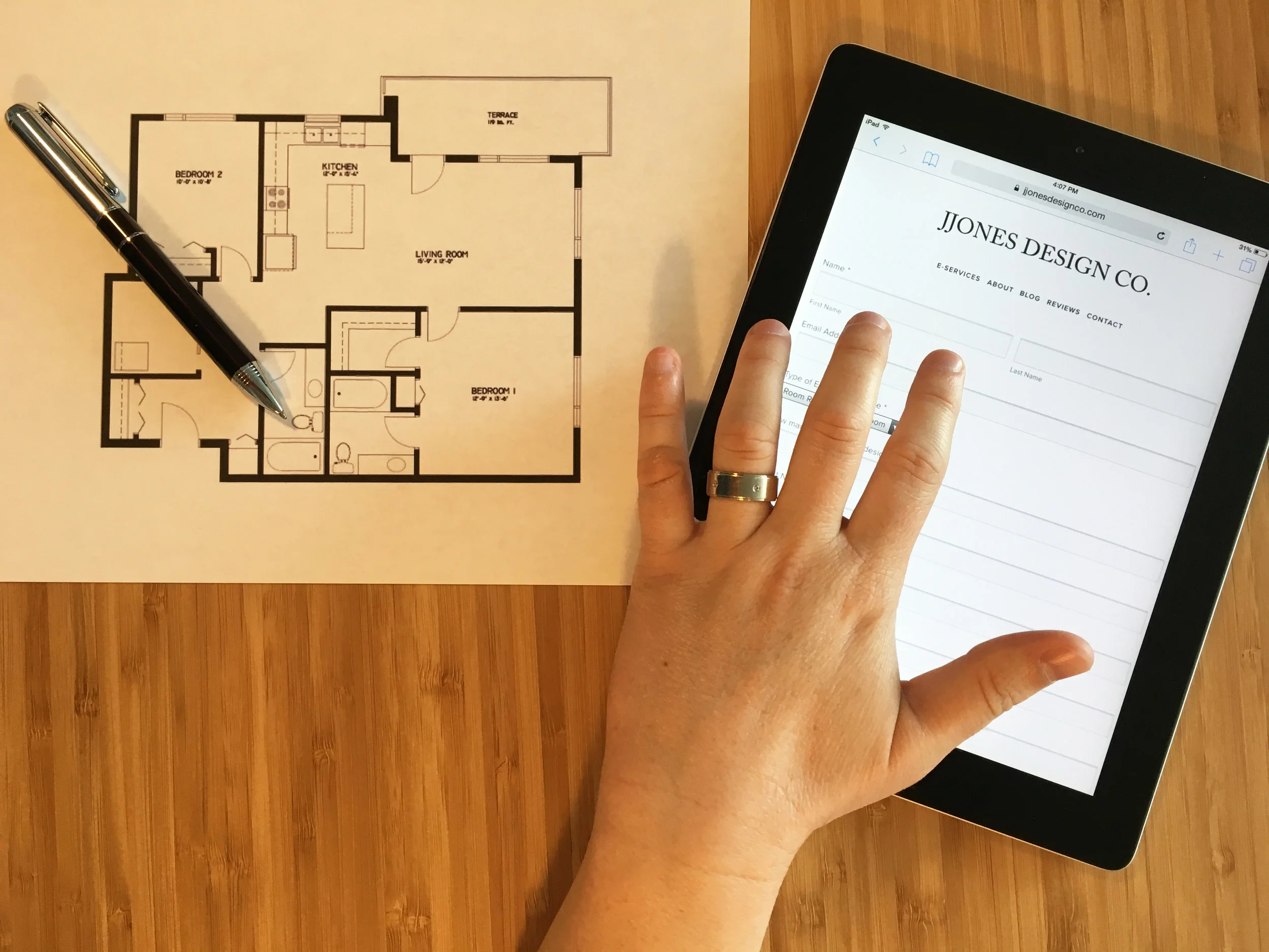 Submitting project information for virtual interior design including a floor plan and online form on a tablet for JJones Design Co.