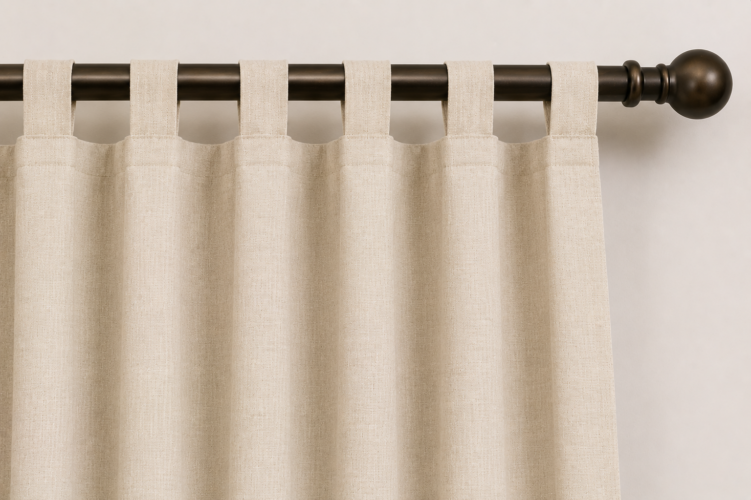 Close-up AI rendering of a cream tab top drapery header featuring fabric loops wrapped around a dark bronze decorative drapery rod, showing the casual construction and soft folds created by the tab top design.