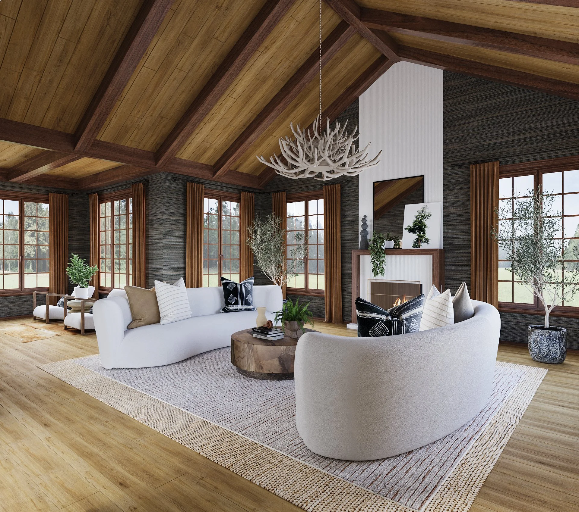 Luxury living room design blending modern organic style with mountain lodge architecture, featuring vaulted wood ceilings, large windows, curved sofas, and natural textures by interior designer Joshua Jones.