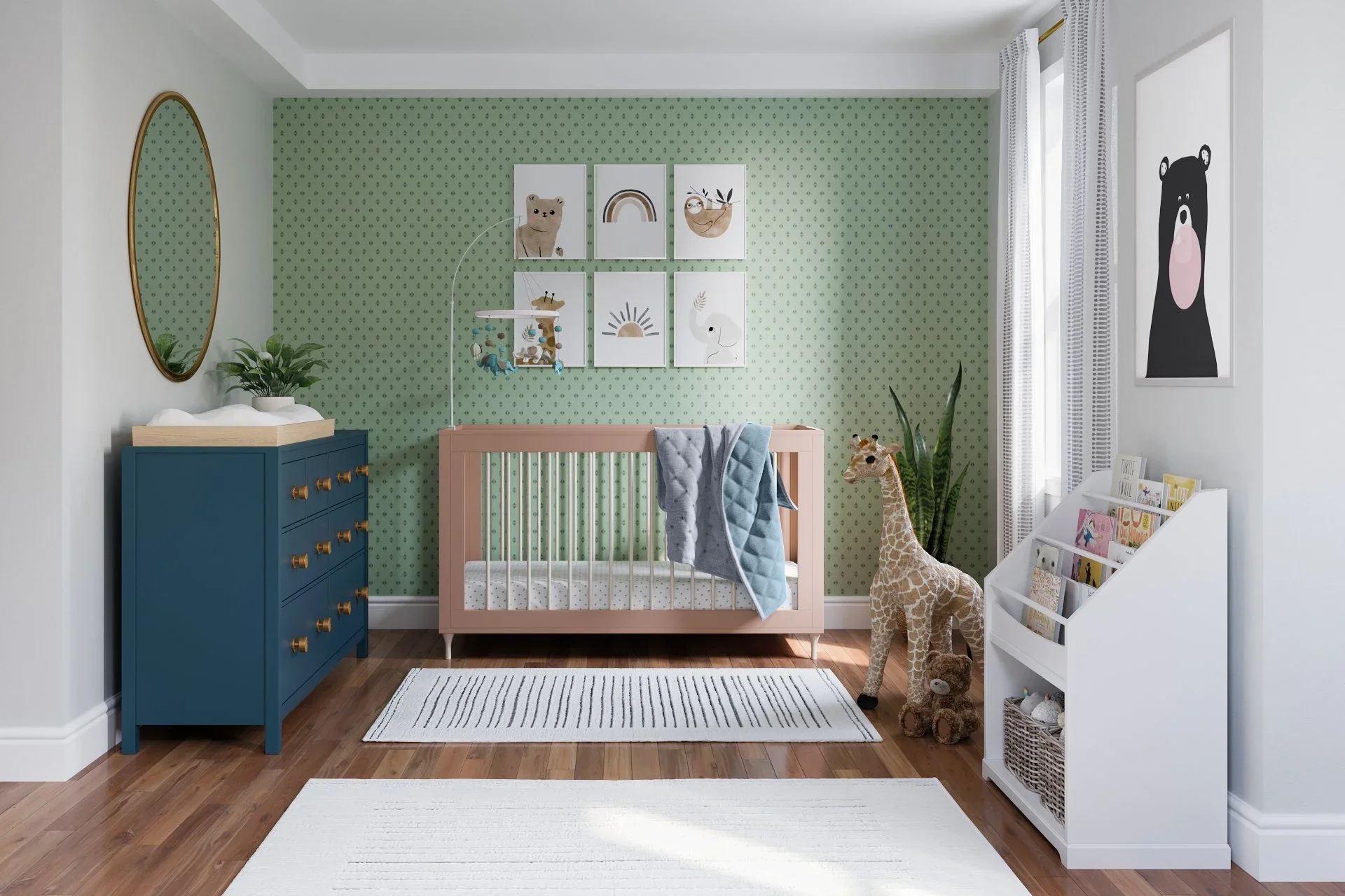 Contemporary gender-neutral nursery designed by virtual interior designer Joshua Jones of JJones Design Co. with green accent wall, blush crib, blue dresser, children’s bookshelf, and neutral rug.