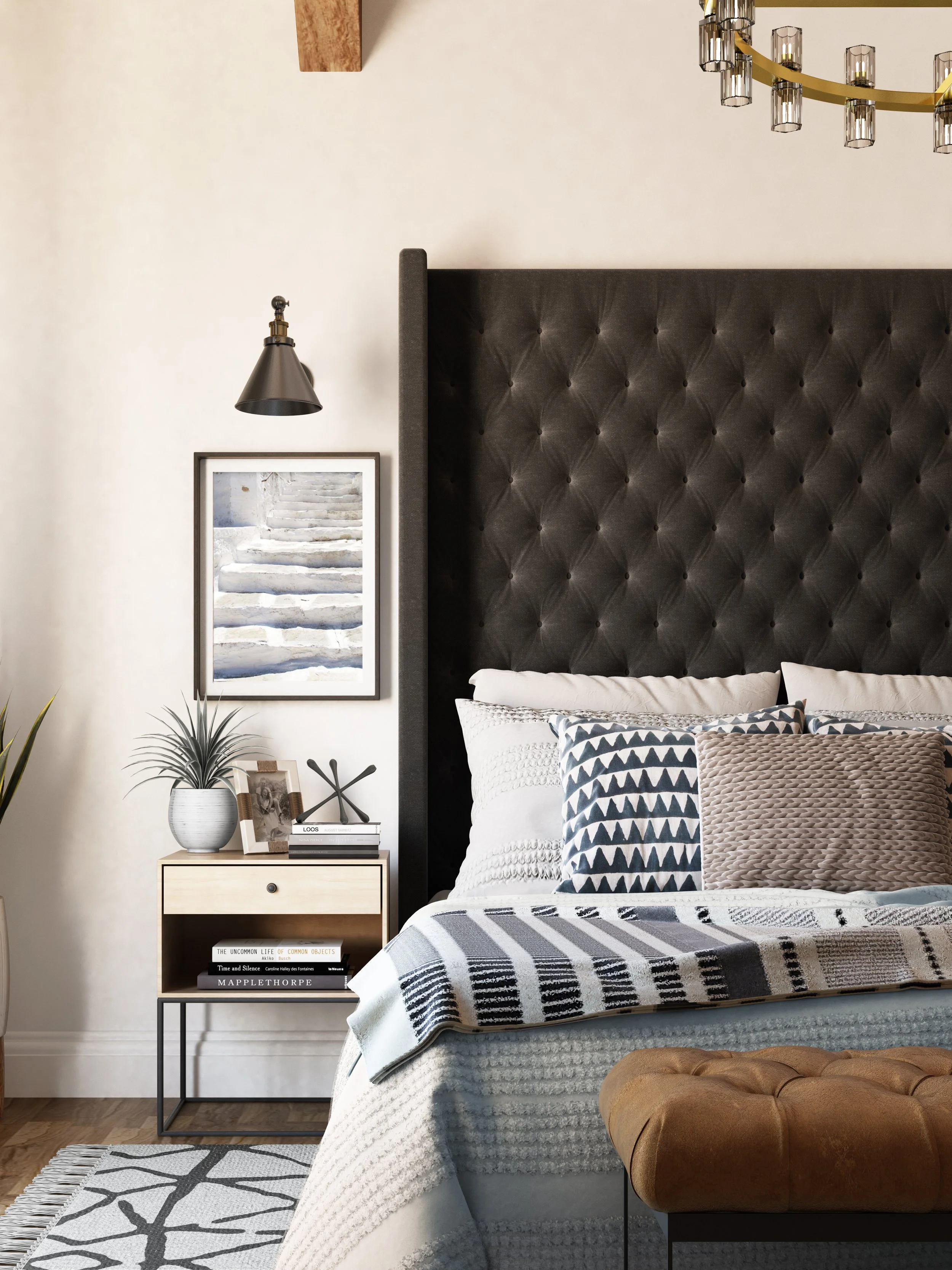 Desert rustic style primary bedroom designed by virtual interior designer Joshua Jones of JJones Design Co. featuring a black upholstered bed and a minimalist bedside table that offers a lighter alternative to a traditional nightstand.