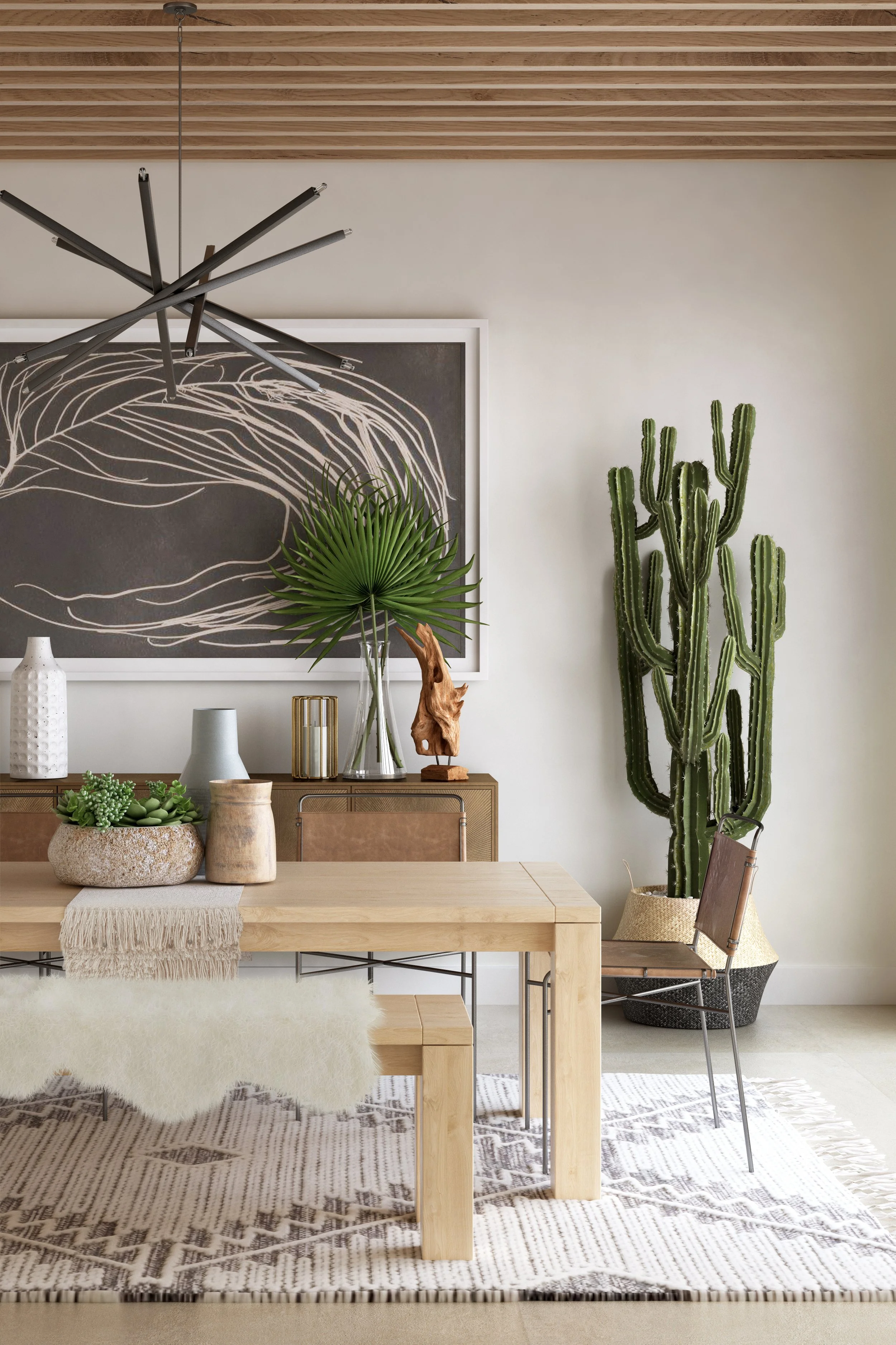 Desert-inspired dining room with neutral tones, wood furniture, cactus plant, layered textures, and curated decor creating a clean and intentional look