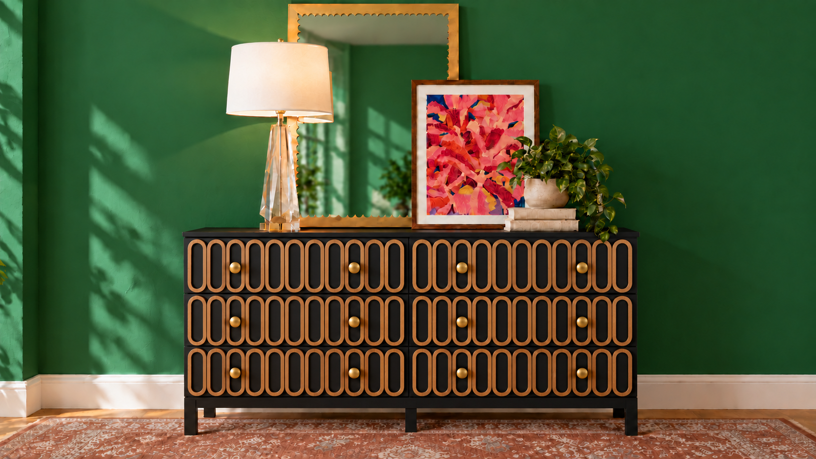 Black IKEA TARVA dresser with oak oval overlays and brass knobs, styled with a mirror, artwork, lamp, books, and plant against a green wall. AI-generated concept styled by virtual interior designer Joshua Jones of JJones Design Co.
