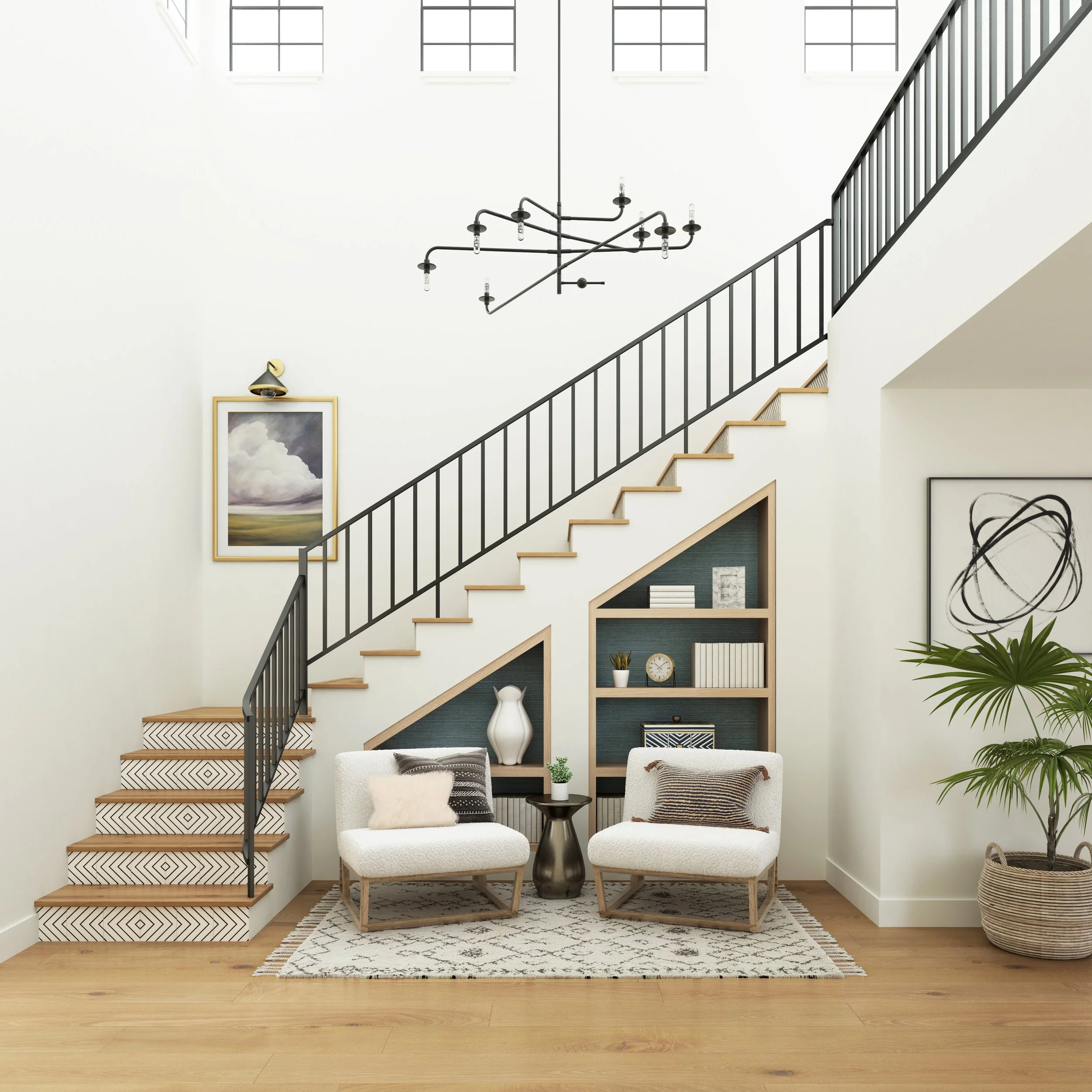California casual foyer designed by virtual interior designer Joshua Jones of JJones Design Co., featuring two accent chairs, a small table, a patterned rug, and built-in shelves beneath an open staircase.