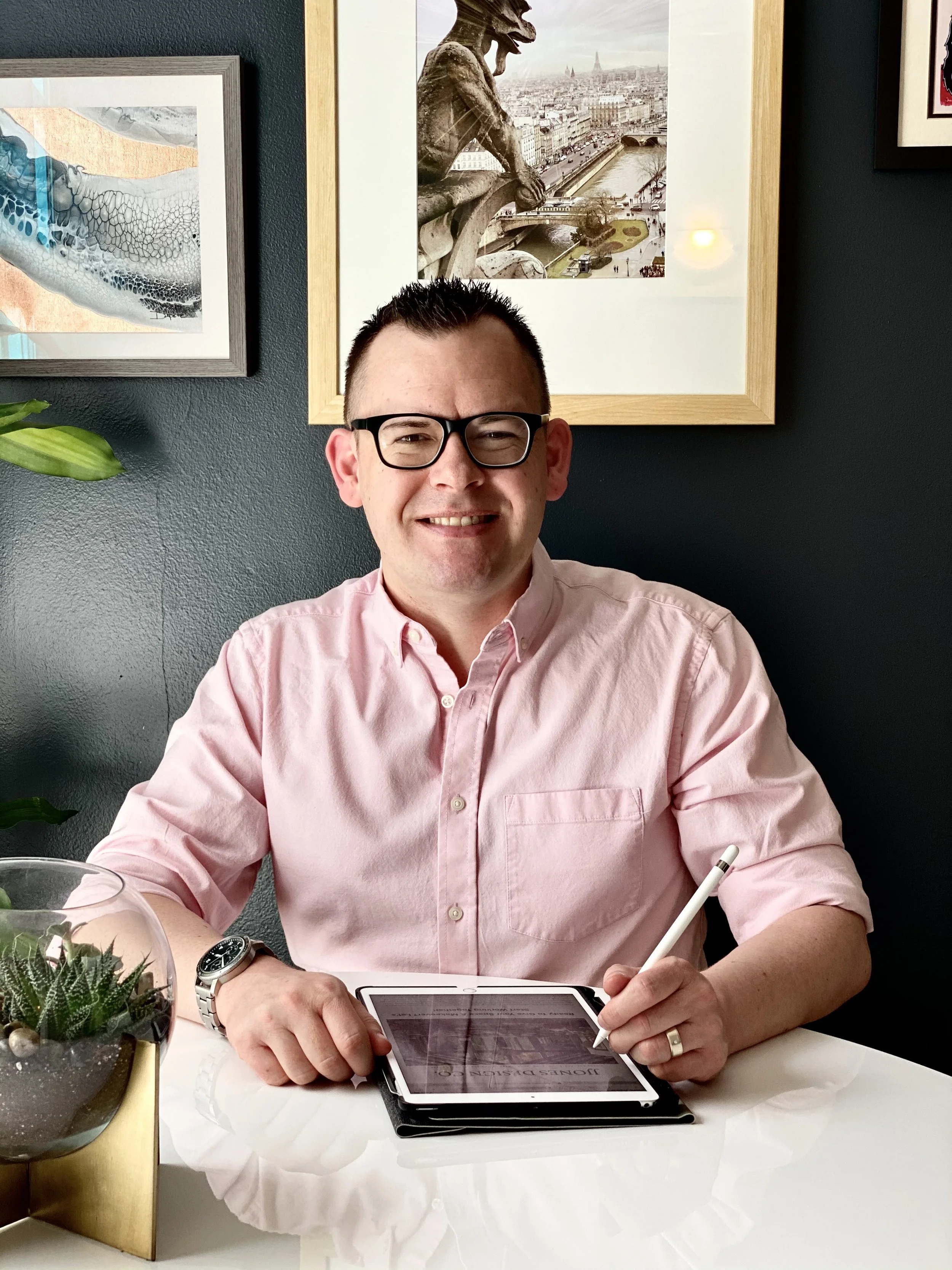 Interior designer Joshua Jones working on a virtual interior design project for the Ask Joshua design advice series.