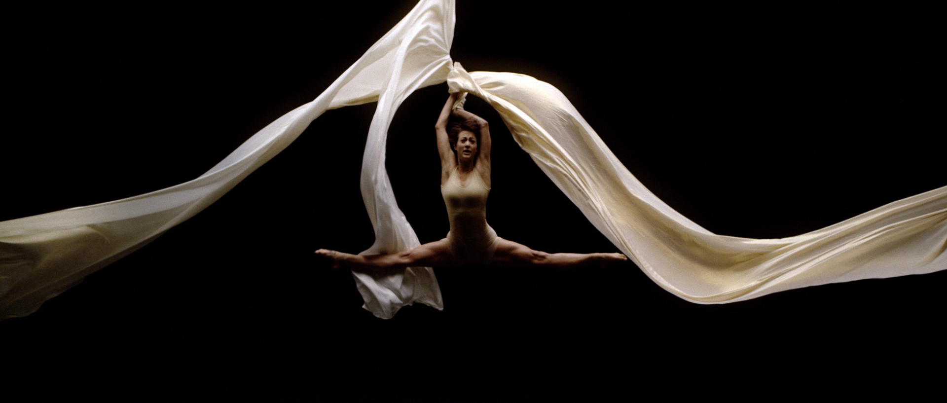 Dancer in split pose in ACER dance commercial | New York Cinematographer, Director of Photography Derek McKane