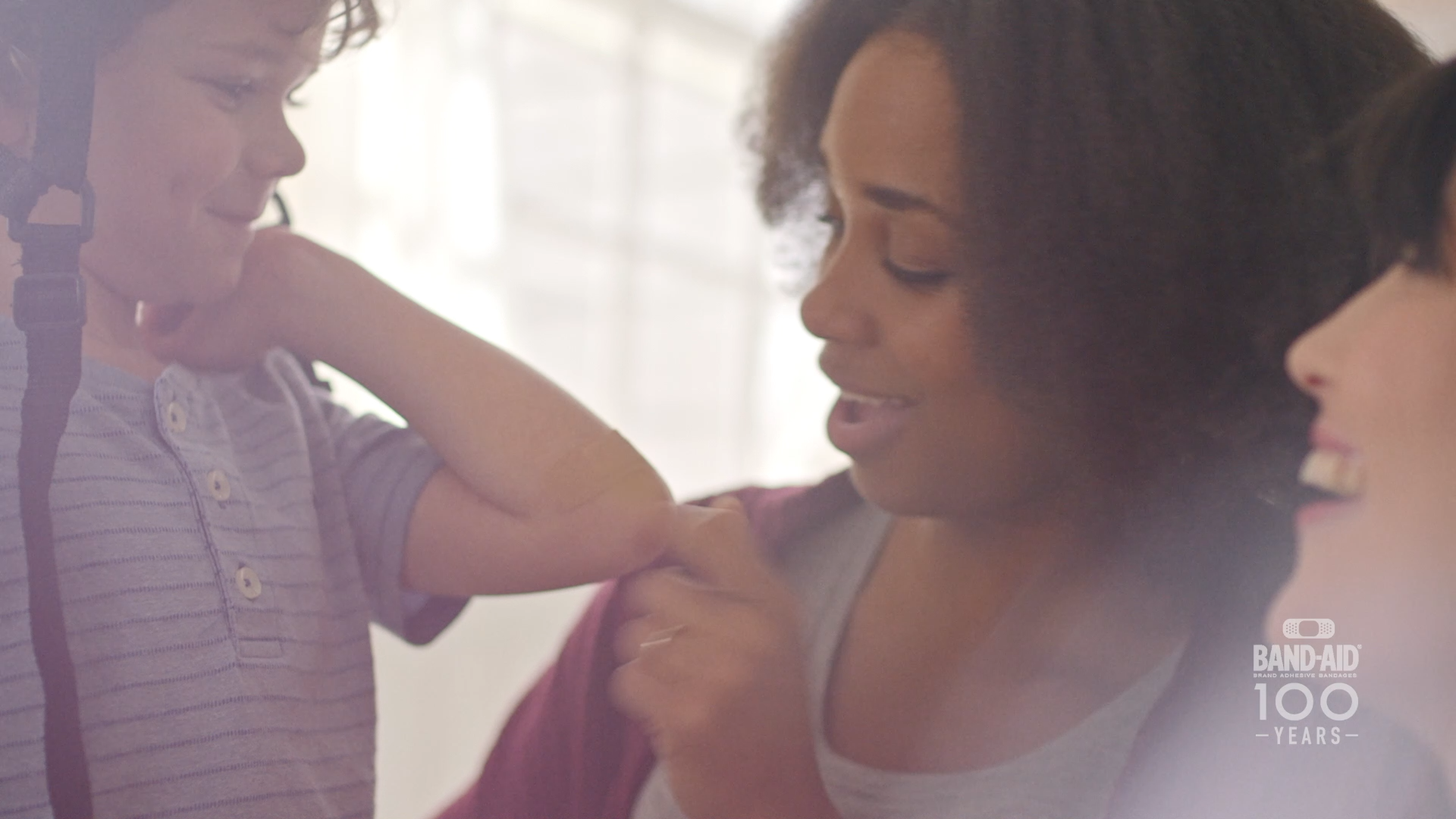 Mom applies Band-Aid in Band-Aid 100 Years of Care commercial
