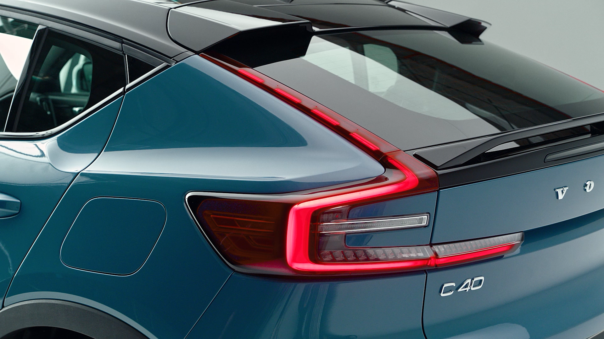 Volvo C40 rear three-quarter view in stylish automotive commercial