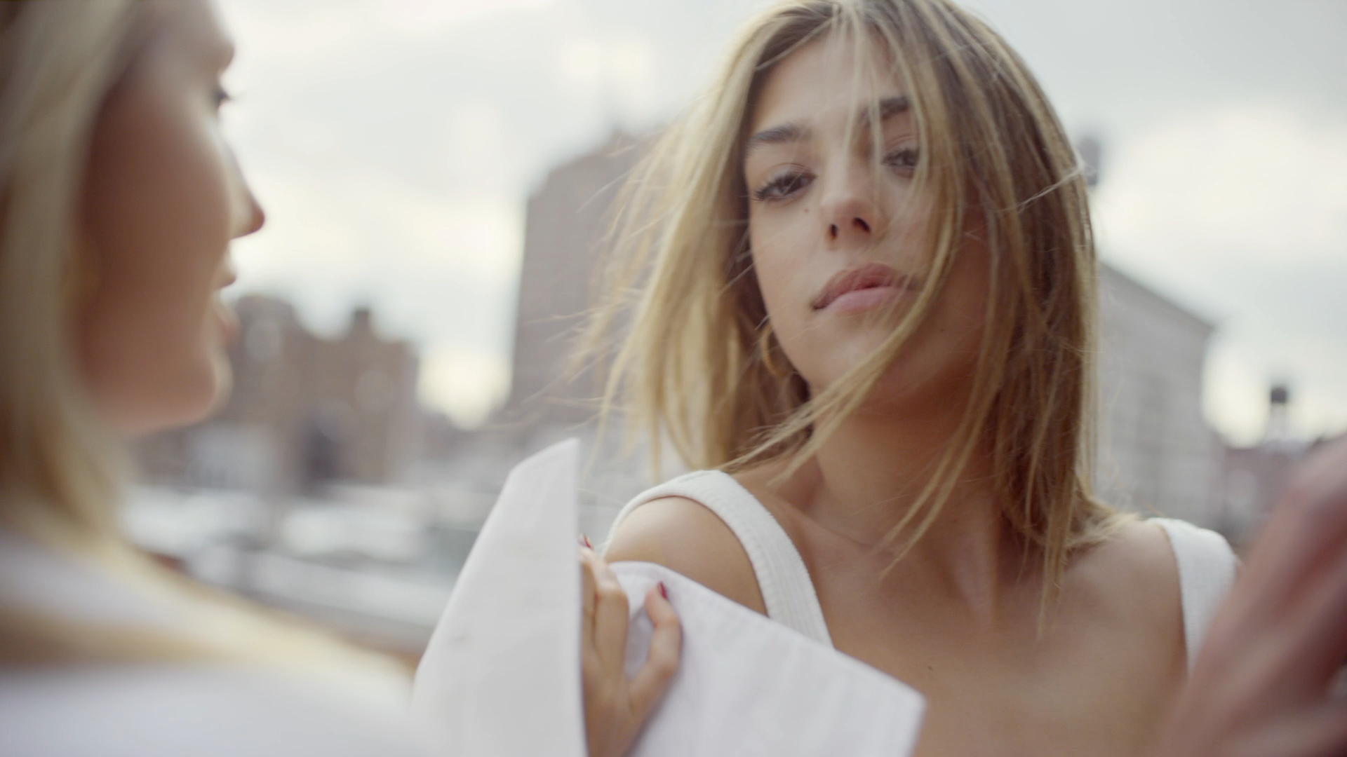 Sistina and Olympia in white over the city from ARE YOU AM I fashion commercial | NY Cinematographer, Derek McKane