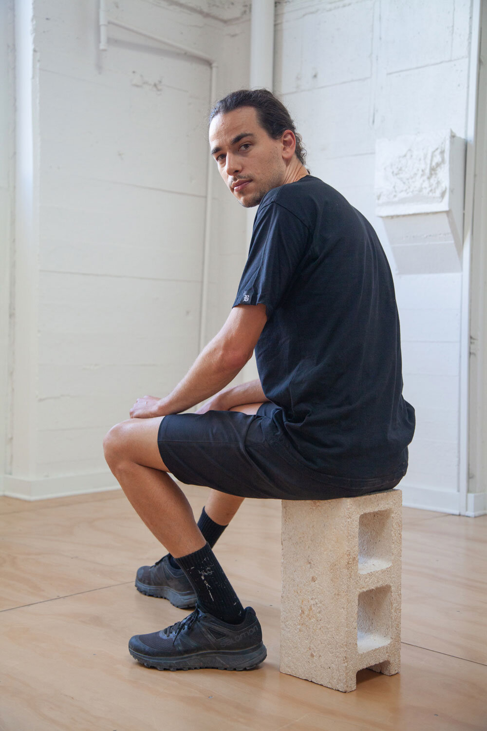 Jerome Tavé seated on Mycelium Building Unit (MCU)