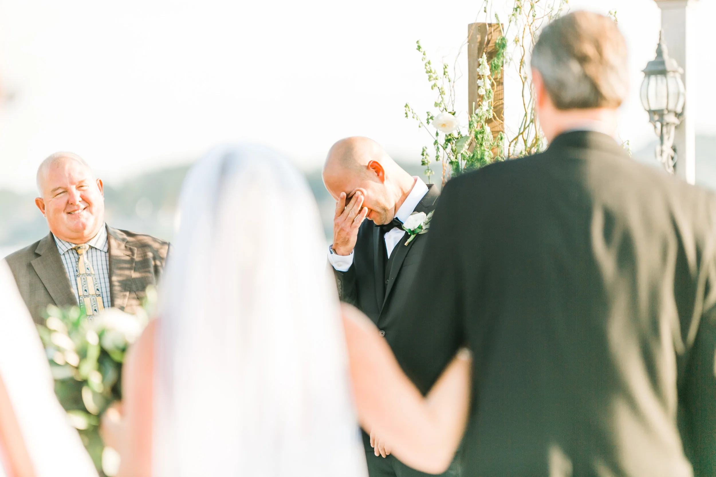 groom crying during first look